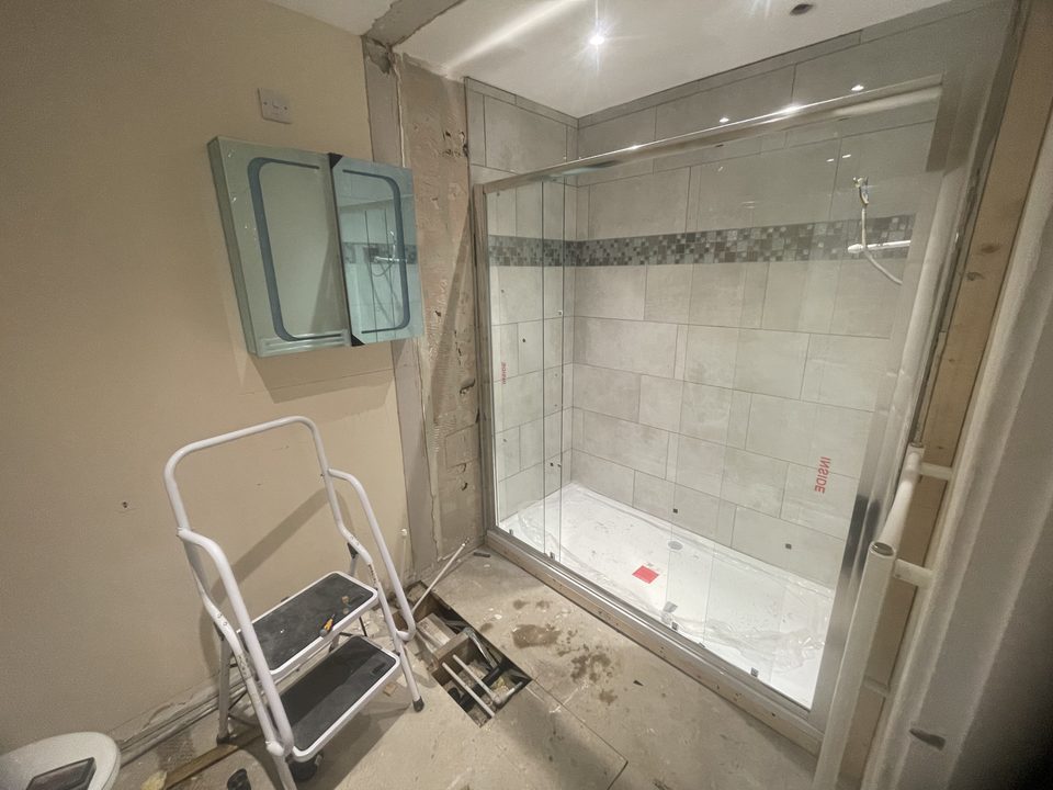Finished walk in shower with a fold down mobility seat