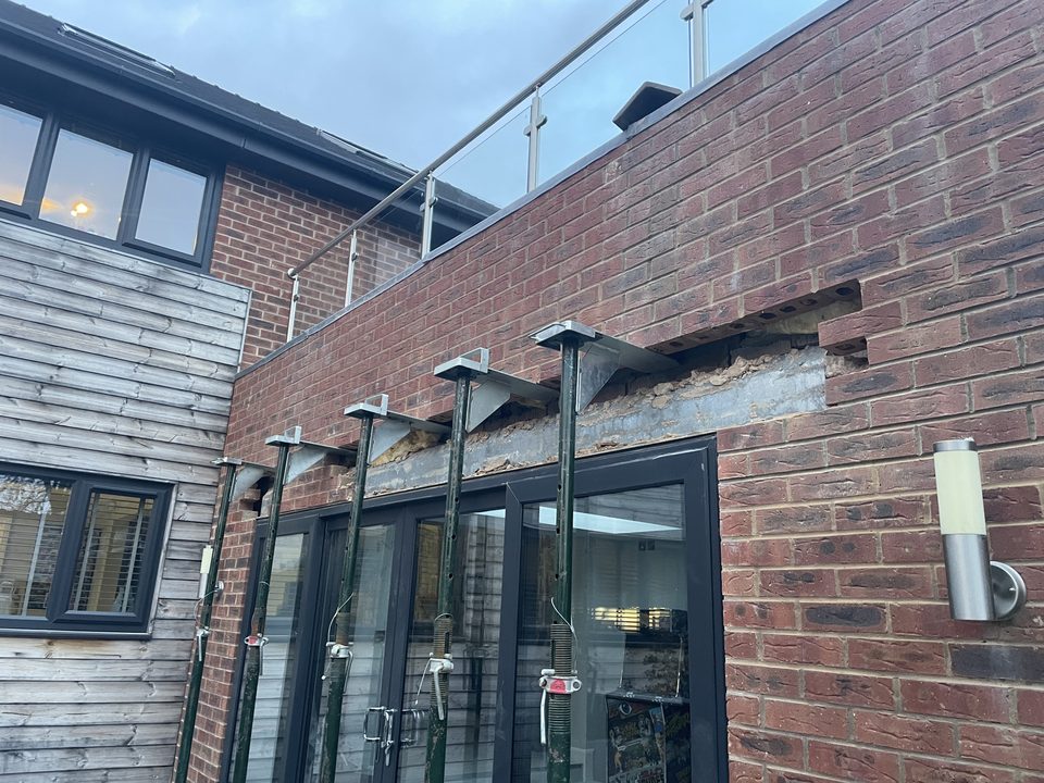 Finished rear extension in brick and cladding with bifold doors