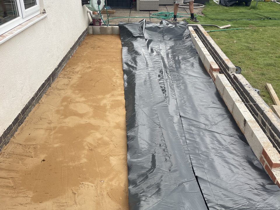 Sand blinding laid over a new extension base