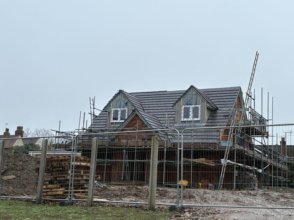 New build roof tiled with the scaffold still up