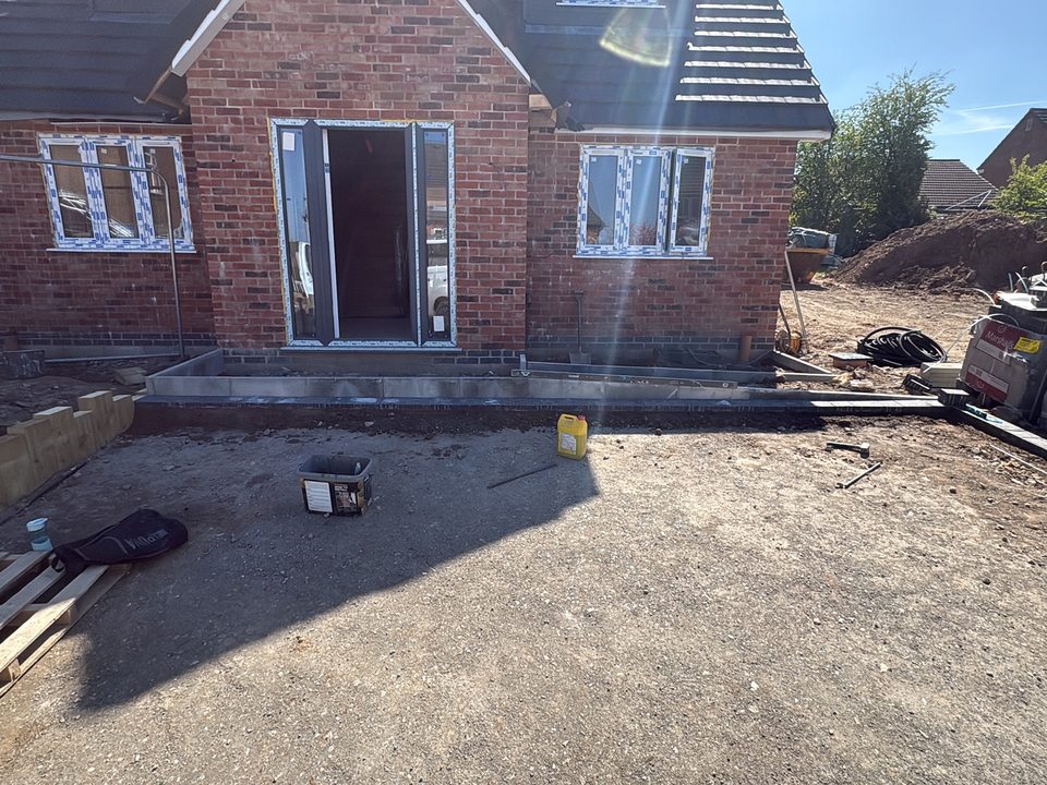 Finished new build front elevation in sunshine
