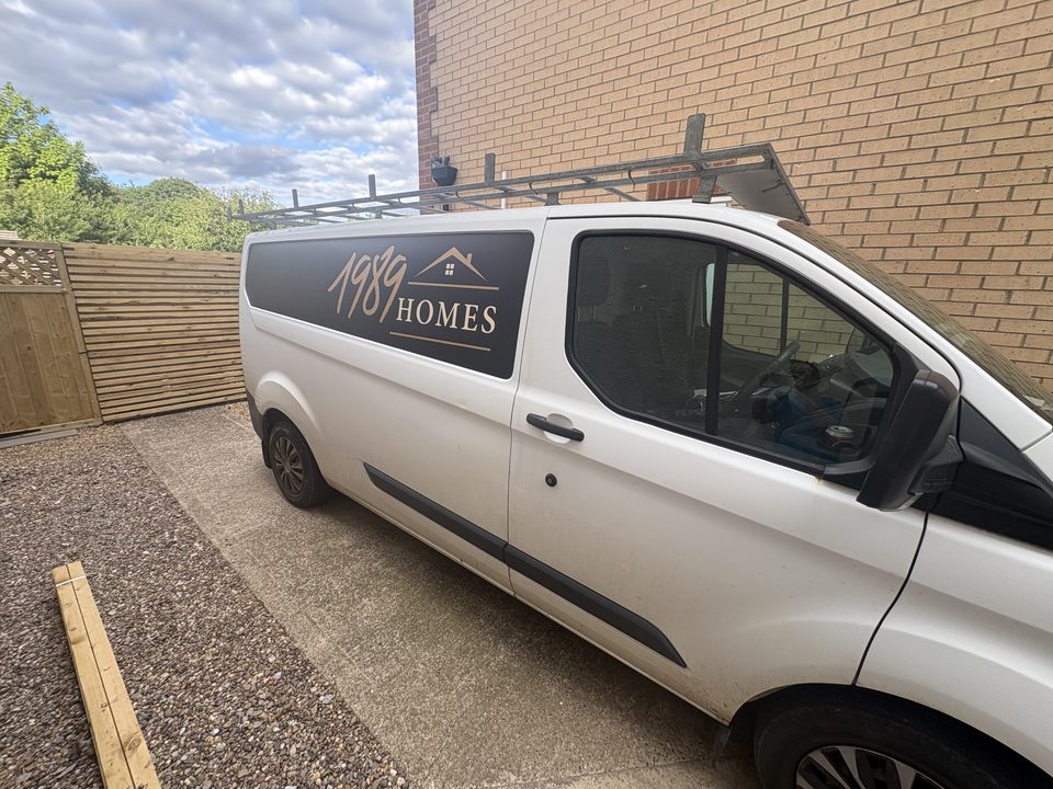 1989 Homes van parked on a completed driveway
