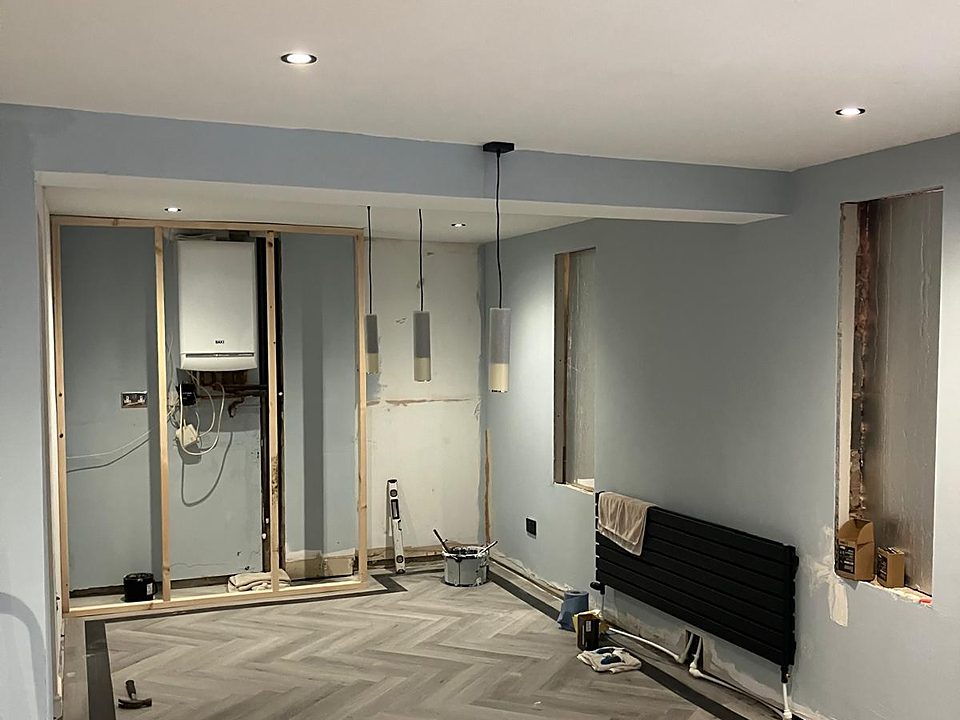 Herringbone floor laid in a room nearing completion
